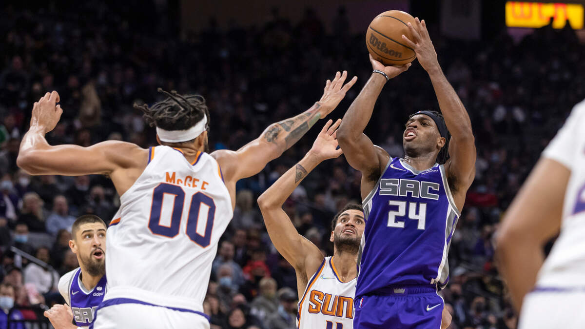 Sacramento Kings guard Buddy Hield (24) makes a jump shot over Phoenix Suns center JaVale McGee (00) during the second quarter on Monday, Nov. 8, 2021 during an NBA basketball game at the Golden 1 Center in Sacramento.
