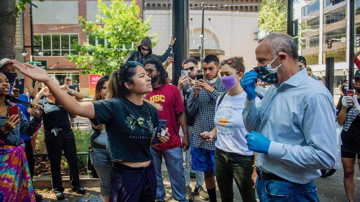 Sacramento Mayor Darrell Steinberg talks Sunday, May 31, 2020, with business owners and community members outraged by the Saturday night looting that followed the George Floyd protests in downtown Sacramento.