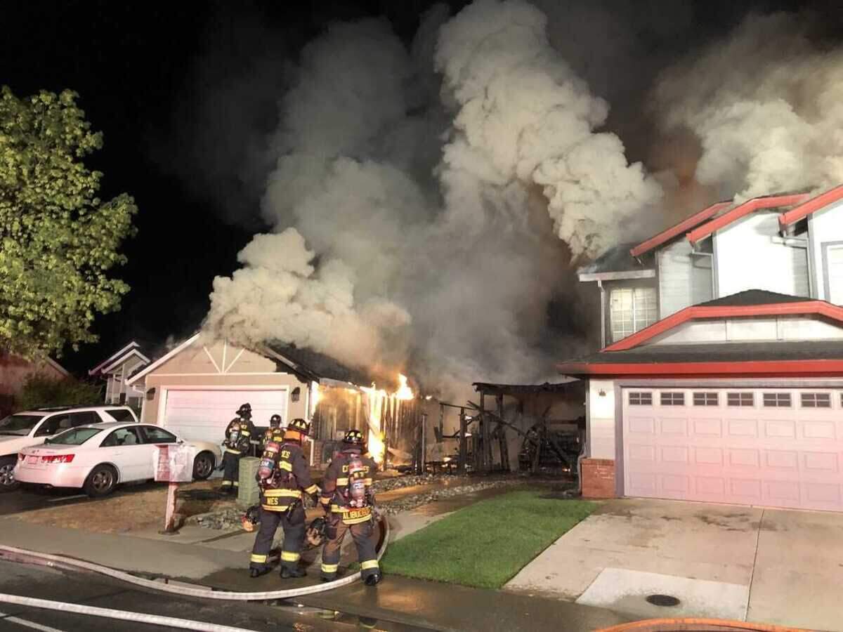 A two-alarm fire burned two homes early Thursday morning Aug. 11, 2022, in the 6900 block of Seasons Drive in Elk Grove, California.