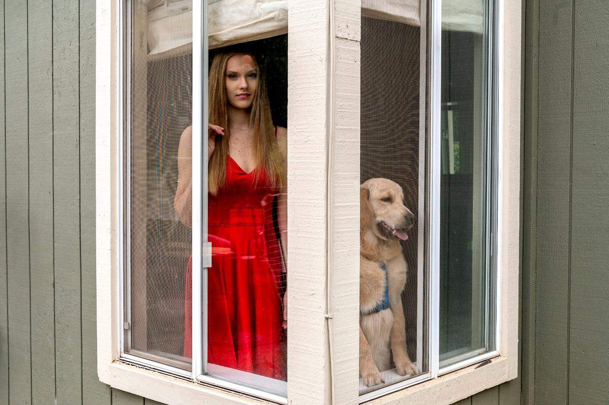 Riley Flynn, 16, of Rocklin, was posing in her prom dress when her dog Barley decided to join in on Wednesday, March 18, 2020. Flynn, a junior at Rocklin High School, joins many high schoolers who are disappointed to miss the life experience at the prom as all events have been canceled due to the coronavirus for the remainder of the school year.