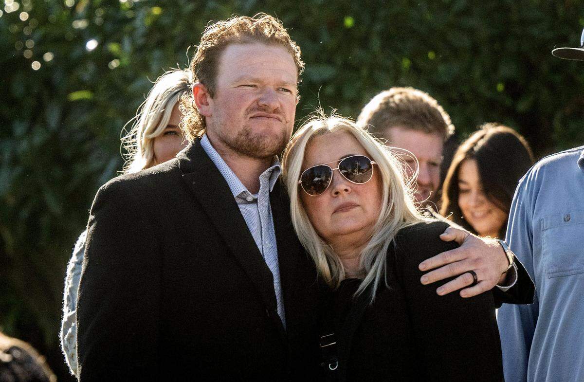 San Francisco Giants pitcher Logan Webb, cousin of fentanyl victim Kade Kristopher Webb, hugs Elizabeth Dillender after she testified on Dec. 5 about her son’s death at Placer Superior Court at a sentencing hearing for Carson David Schewe, who was convicted in the case in September.