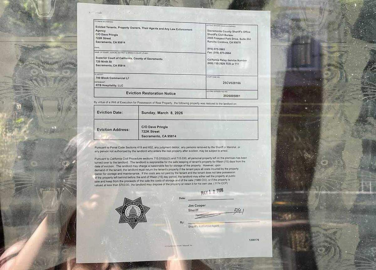 An eviction notice posted on the entrance of Tiger Restaurant & Lounge. The notice listed an eviction date of March 8.