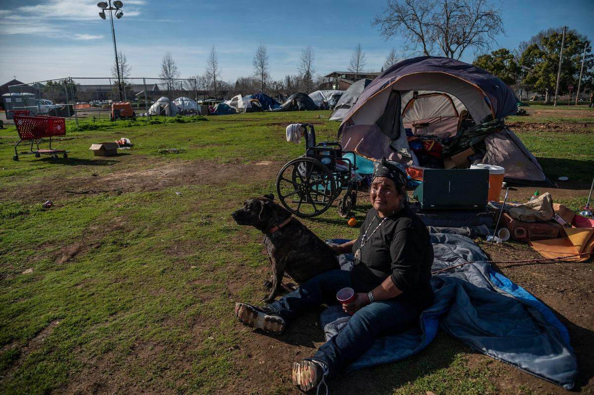 Angela Wells, 57, said she has been living in the homeless encampment with her service dog since May. “I never expected to be homeless in my home town,” said Wells. “There are quite a few of us that aren’t looking for a handout but are looking for a hand up.” said Wells.