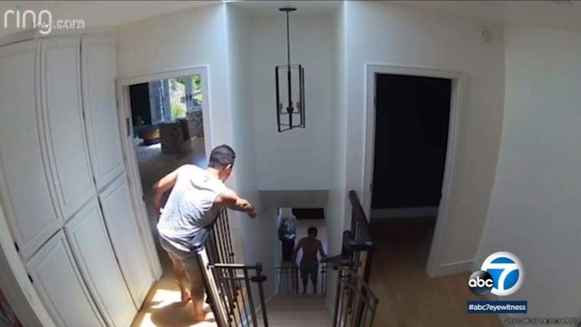 Homeowner Mat Sabz, left, confronts a naked intruder in his Bel Air, California, home on security video.