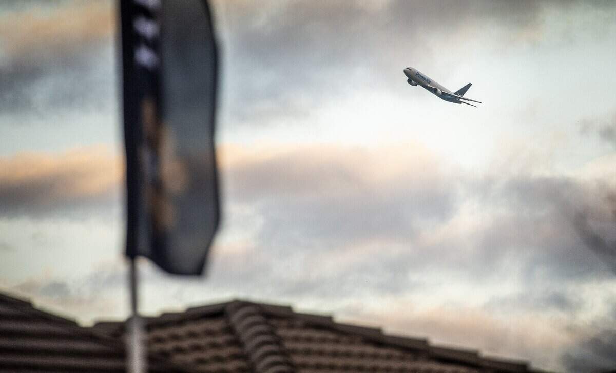 A Prime Air jet flies over homes in Natomas on Wednesday, April 3, 2019, where many residents have complained of increased noise early in the morning because of new flight patterns at Sacramento International Airport.