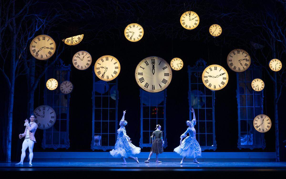 Playing Cinderella, Michelle Katcher, center, turns back to ragged clothing as the clocks strike midnight after meeting her prince at the ball, played by Victor Maguad, left, during a Sacramento Ballet dress rehearsal on Thursday at the SAFE Credit Union Performing Arts Center.