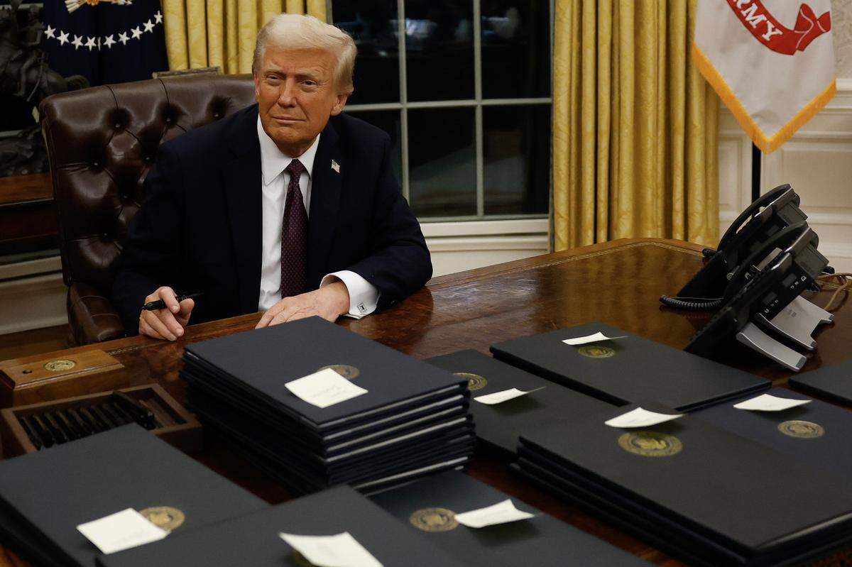 President Donald Trump signs executive orders in the Oval Office on Monday, Jan. 20, 2025, in Washington, D.C.