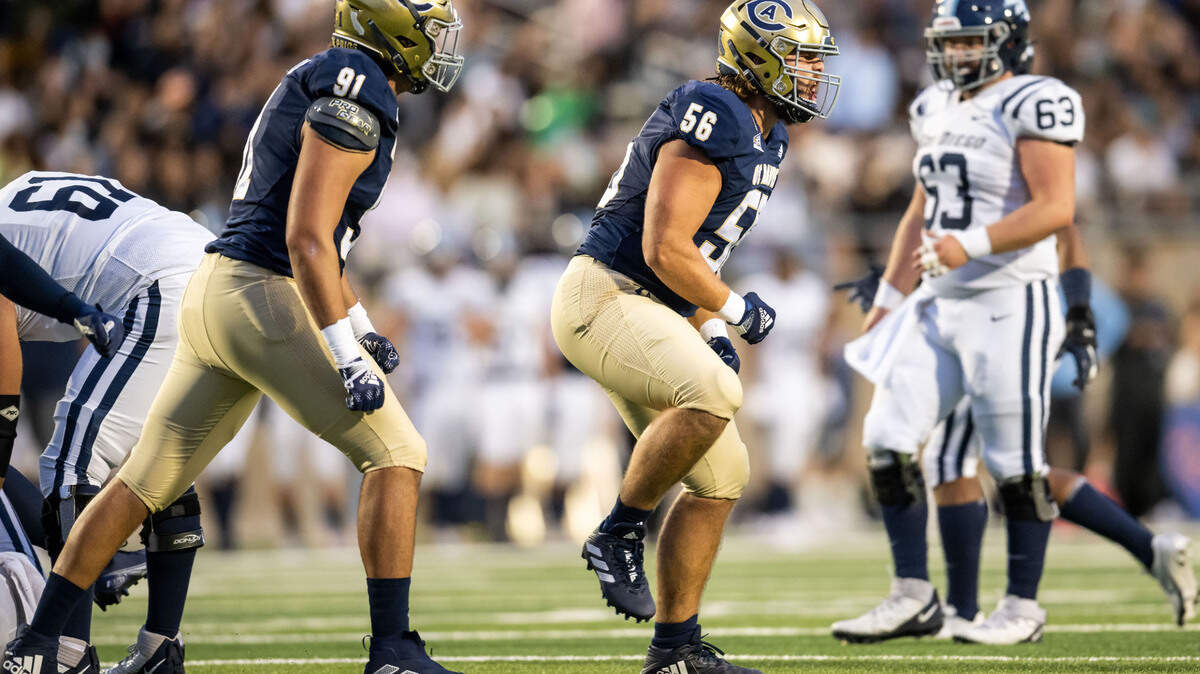 UC Davis Aggies defensive lineman Justin Martz (56) celebrates sacking San Diego Toreros quarterback Judd Erickson (8) on third down to force a punt on the first drive of the NCAA college football game Saturday, Sept. 17, 2022, at the Aggies’ home opener at UC Davis Health Stadium.