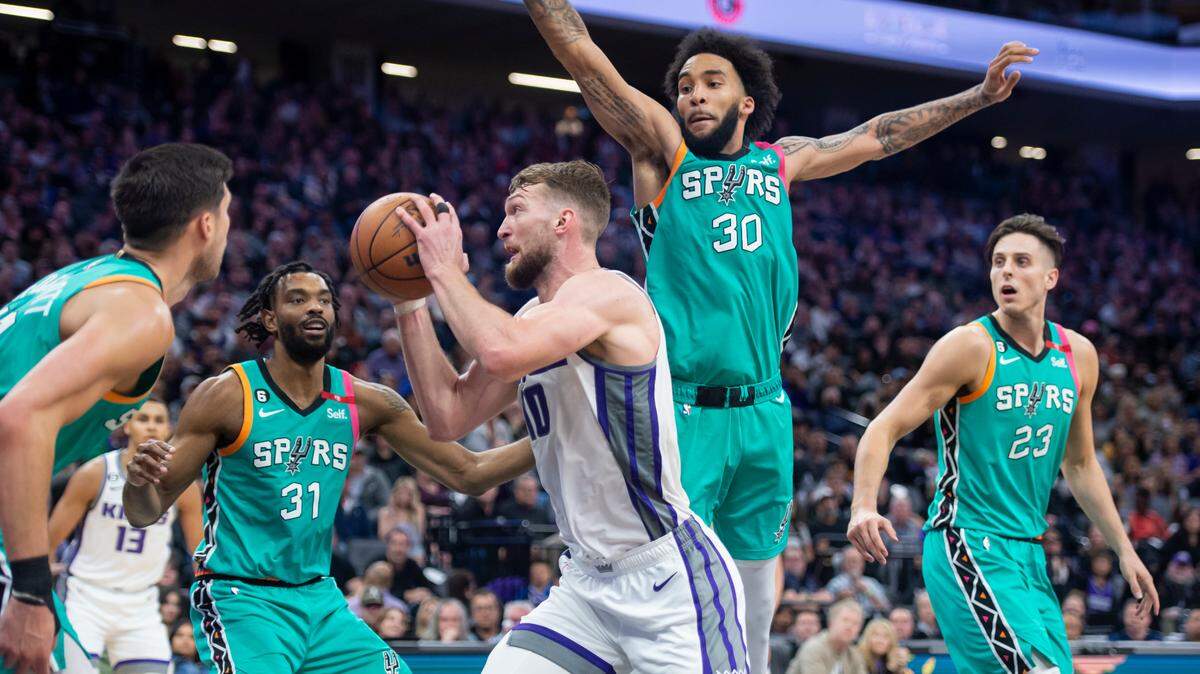 Sacramento Kings forward Domantas Sabonis (10) battles to go up for a layup drawing the foul and makes both free throws of the NBA basketball game Sunday, April 2, 2023, at Golden 1 Center. Sabonis had 26 points and eight rebounds. The Spurs won 142-134 in overtime.