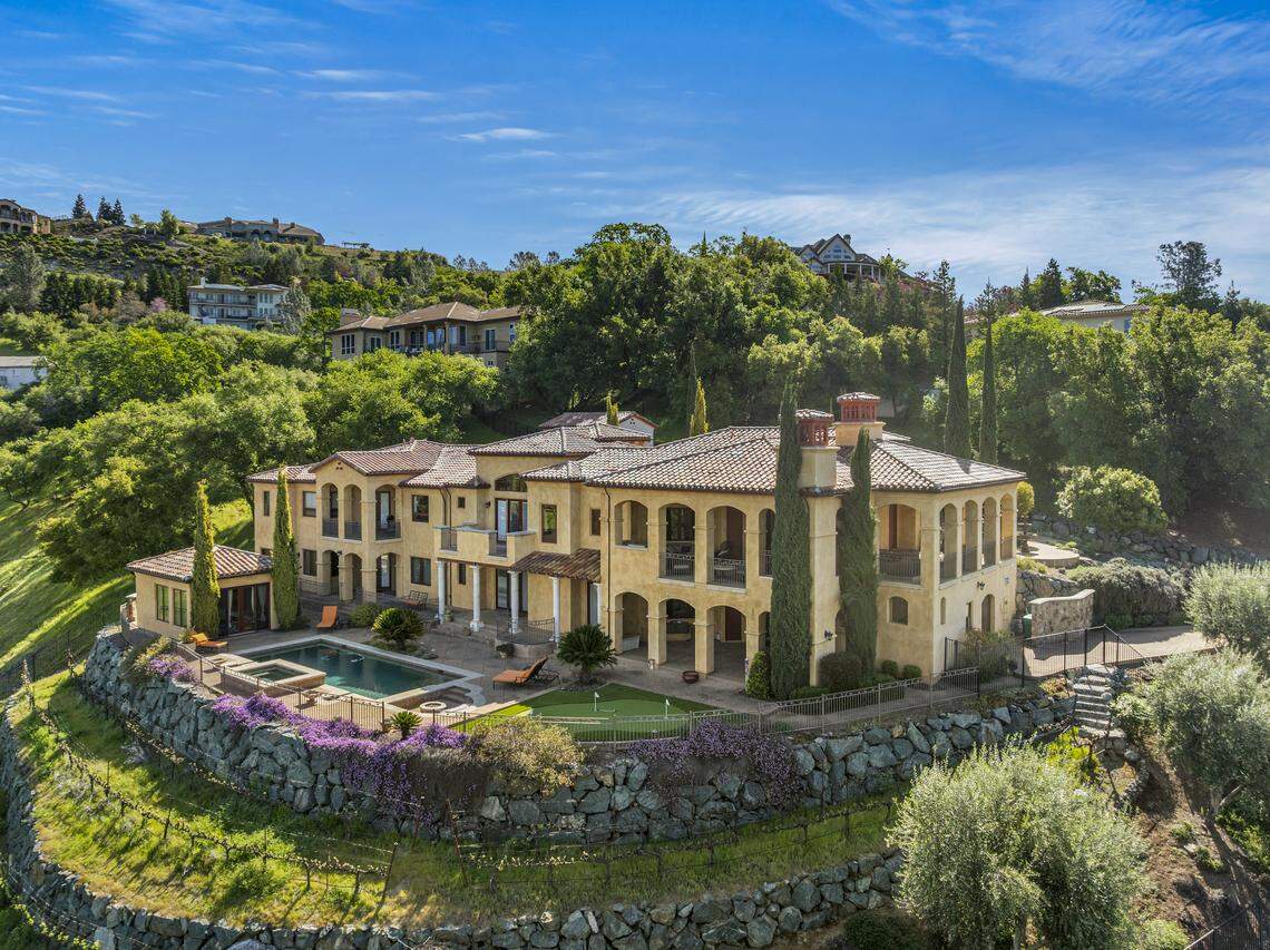 This stunning Mediterranean villa in El Dorado Hills, California, boasts 5 bedrooms, 6 bathrooms, and over 7,300 square feet of luxurious living space—including a separate guest casita and pool house.