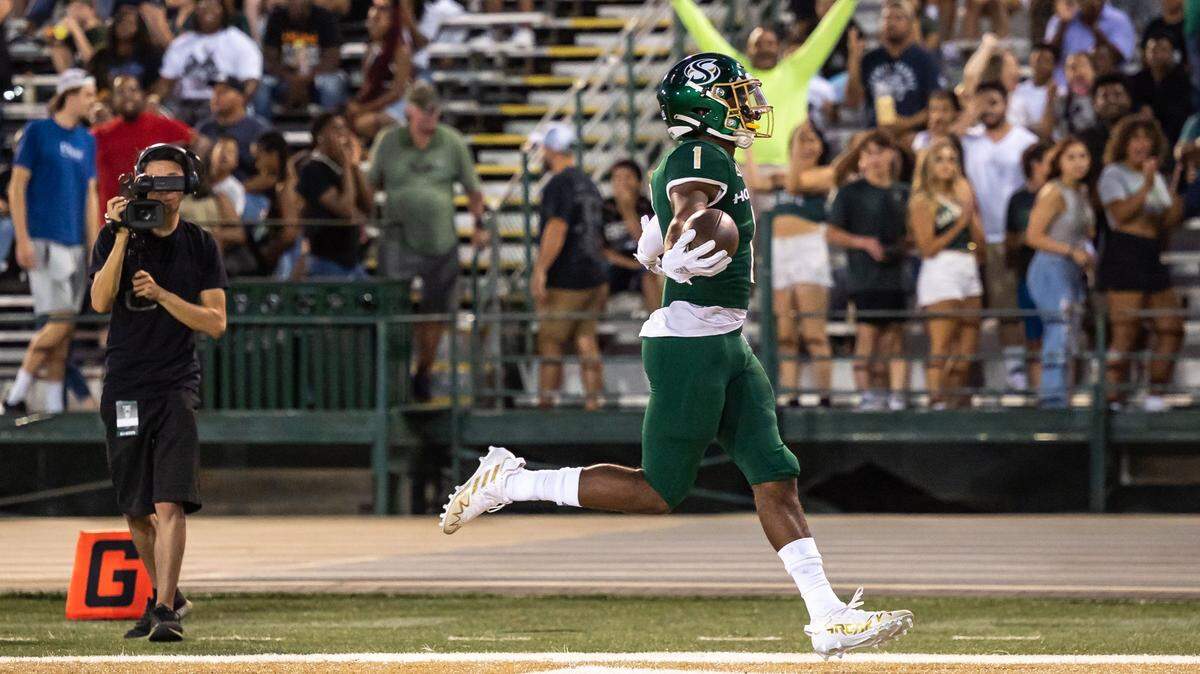 Sacramento State cornerback Caleb Nelson (1) scores a touchdown after running an interception back 98 yards during the first quarter against Utah Tech at the NCAA college football game on Sept. 3 at Hornet Stadium in front of a healthy crowd.