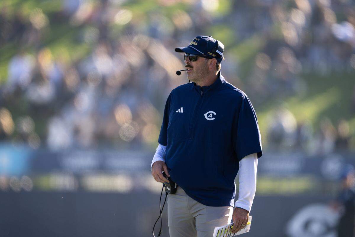 UC Davis Aggies head coach Tim Plough looks out at the field of play in the first half against the Sacramento State Hornets in the Causeway Classic on Nov. 22.