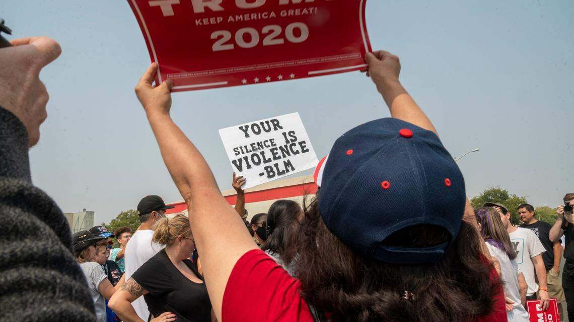 A sign supporting President Donald Trump clashes with a Black Lives Matter sign outside McClellan Park in Sacramento County. A UC Davis survey released Wednesday, July 20 2022 reveals deteriorating attitudes on political violence.
