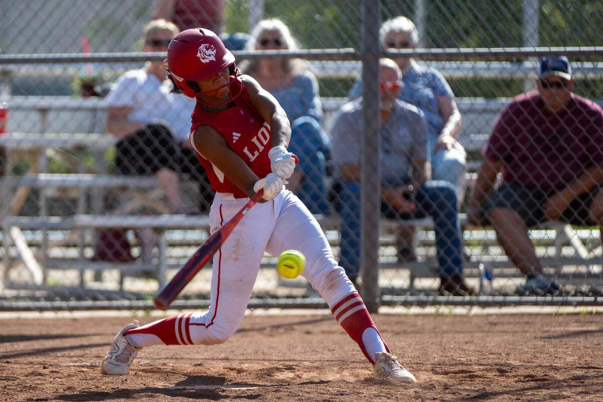The McClatchy Lions’ Jayeliza Rogers hits a single against the Folsom Bulldogs during a first-round CIF Sac-Joaquin Section Division I softball playoff game at Folsom High School on Wednesday in Folsom.