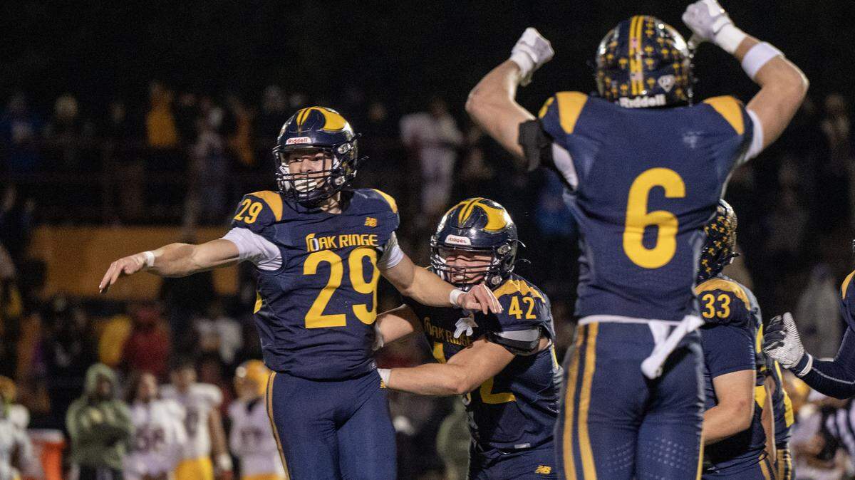 The Oak Ridge Trojans' Kyle Boeker (29) celebrates with teammates after making the game-winning field goal as time expired in the fourth quarter to give the Trojans a 9-7 victory over the Grant Pacers in the CIF Sac-Joaquin Section Division l semifinal football playoff game in El Dorado Hills on Friday, Nov. 21, 2025.