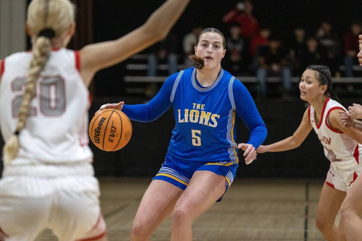 The Faith Christian Lions’ Lauren Harris (5) dribbles in the first half against the Sacramento Adventist Capitals on Tuesday in Carmichael.