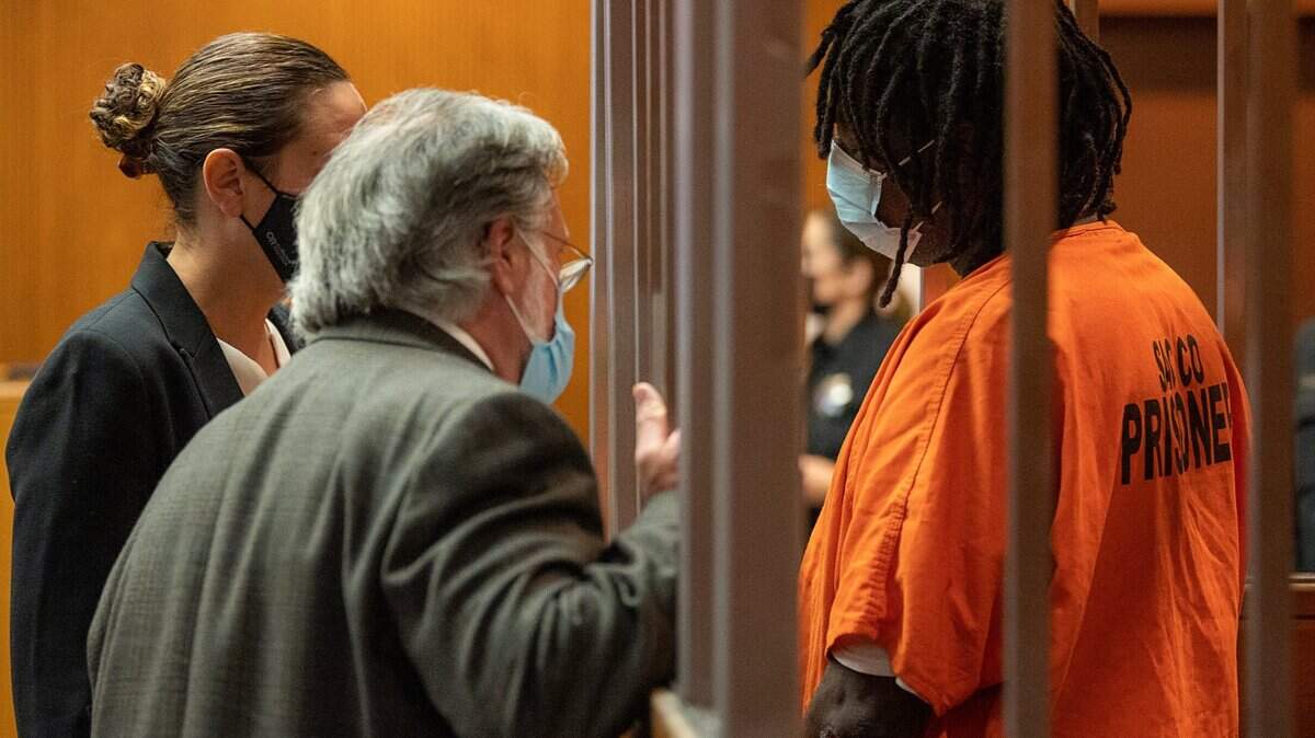 Troy Davis consults with public defenders Meghan Cunningham and Norman Dawson as he is charged in Sacramento Superior Court with six felony counts, including murder, on Tuesday, Sept. 7, 2021, in the Friday home invasion slaying of Kate Tibbitts and her two dogs on 11th Avenue in Sacramento’s Land Park neighborhood.