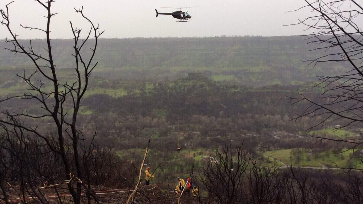 Cal Fire Butte Unit crews respond to reports of a vehicle driving off a cliff near Lookout Point on Skyway Road on Monday, March 25, 2019.