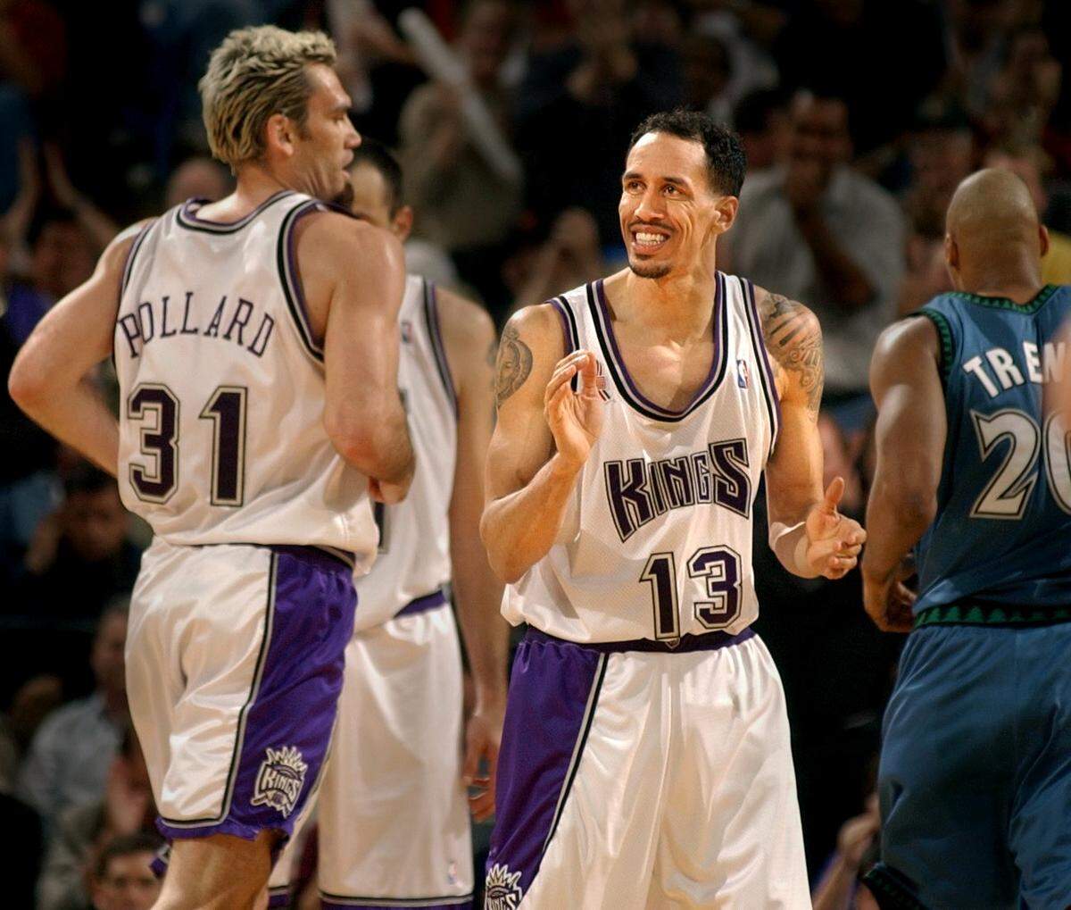 Sacramento Kings’ guard Doug Christie encourages Scot Pollard after he scored against the Minnesota TImberwolves on April 9, 2002, at Arco Arena.