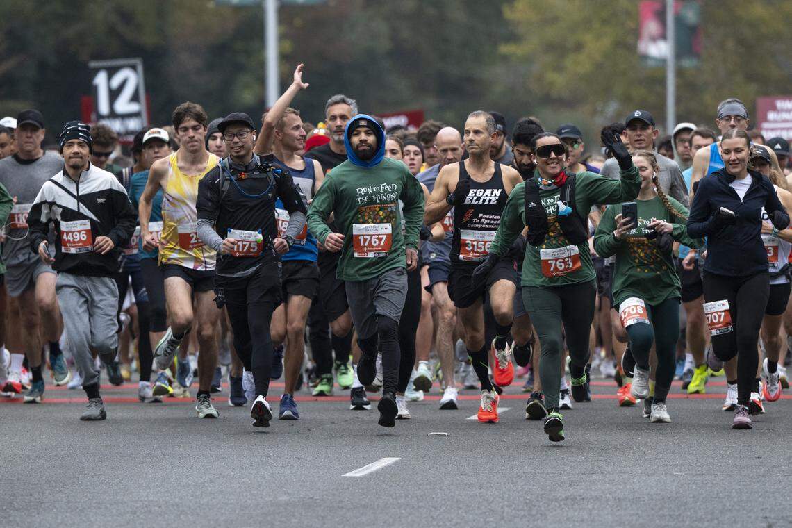 Race participants start the 10k race during the Run to Feed the Hungry in Sacramento on Thursday, Nov. 27, 2025.