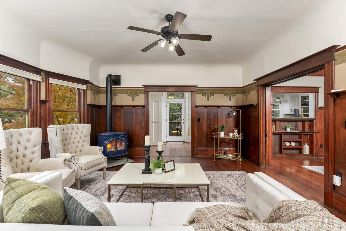 The living room features pocket doors that allow privacy or seamless flow while entertaining.