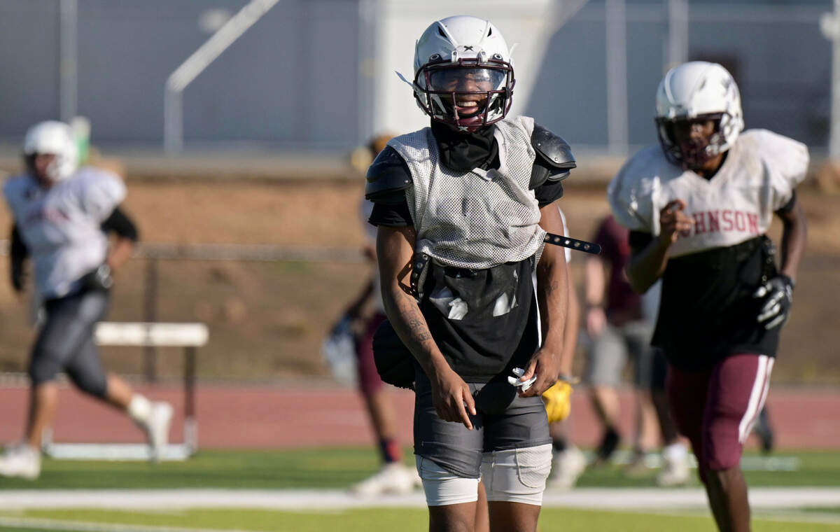 Hiram Johnson High School’s Jhayson Fowler — a multi-position football player who primarily plays at wide receiver, safety and quarterback — smiles at practice with his team Tuesday at the school in Sacramento.