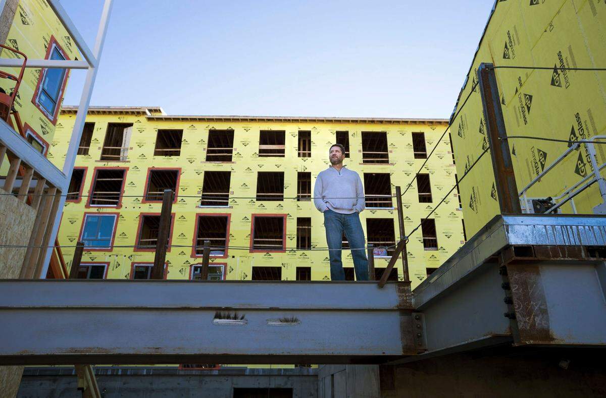 in 2017, Mike Heller, a lead developer of the Ice Blocks project on R Street, stands in the housing and retail section of the project.