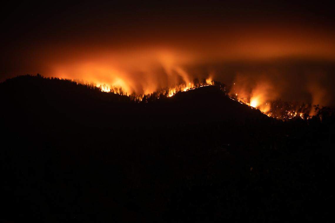 Caldor Fire burns Tuesday night, Aug. 17, 2021 in Grizzly Flats in a long exposure image.