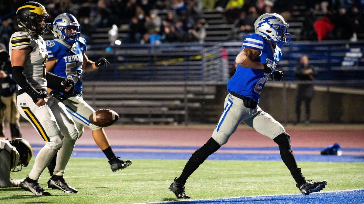 Rocklin’s Elias Mullican, right, celebrates running 46 yards in to scoring position against Del Oro during the second quarter of the high school football game Friday, March 19, 2021, in Rocklin. Rocklin beat rival Del Oro 29-21.