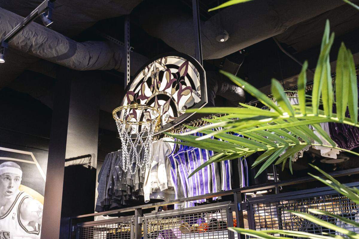 The new Kings merch store showcases a 24K gold-plated basketball hoop decked out with a Swarovski crystal net created by artist Victor Solomon.