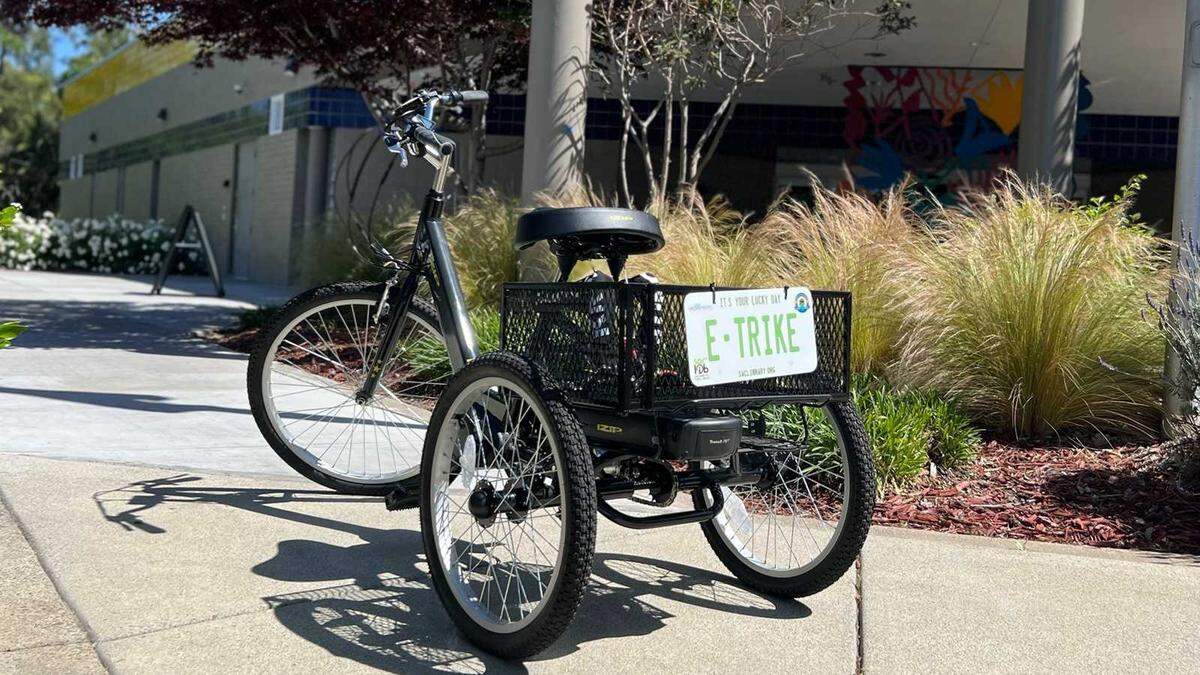 An electric tricycle is seen outside the Belle Coolidge Branch of the Sacramento Public Library. The South Land Park location is one of four now offering free e-bike and e-trike loans to adults with a library card.