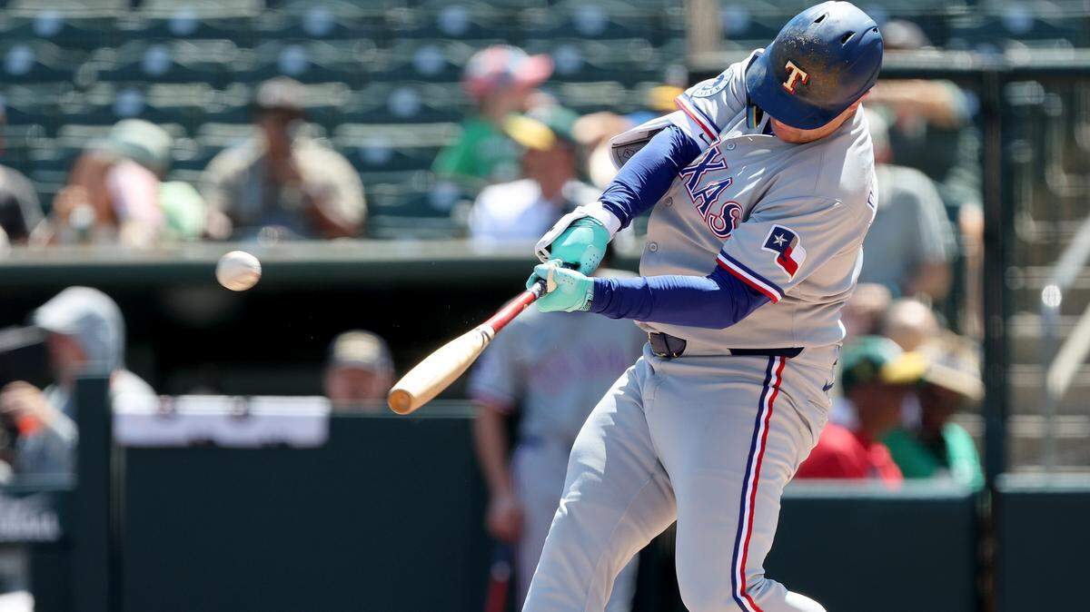 Aug 31, 2025; West Sacramento, California, USA; Texas Rangers designated hitter Joc Pederson (4) hits a two-run home run against the Athletics during the first inning at Sutter Health Park. Mandatory Credit: Dennis Lee-Imagn Images