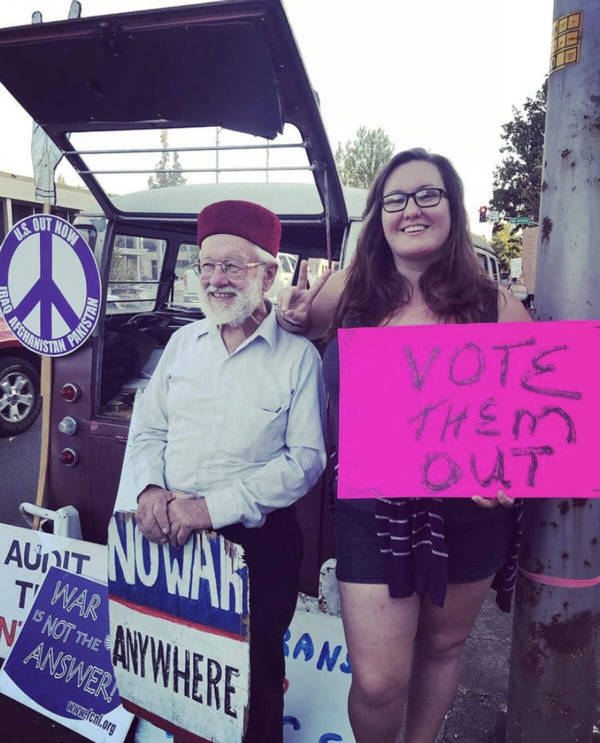 Robin Epley and her grandfather, Edward, at one of his nightly protests for world peace.