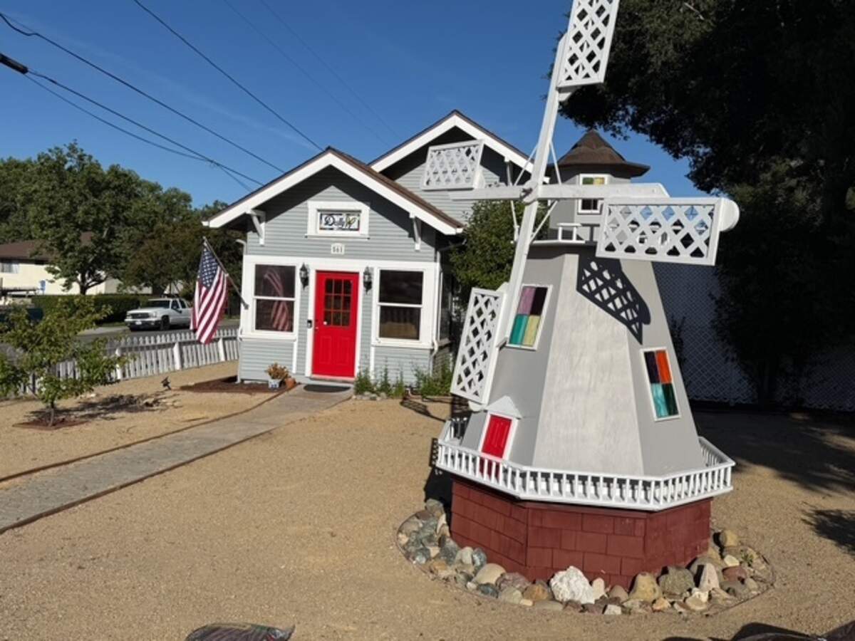 The triplex at 561 Alisal Road in Solvang is listed for $1.995 million and is marketed as Dolly Parton’s former retreat, with three units totaling about 2,500 square feet.