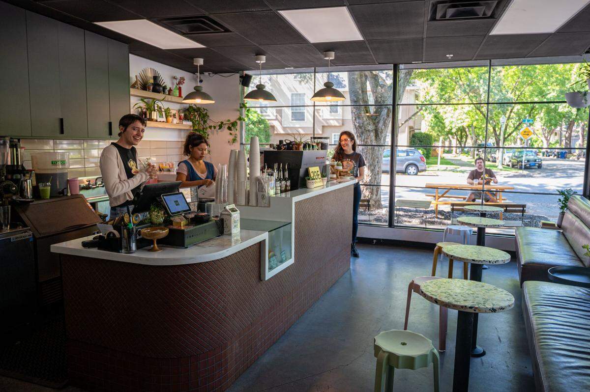 Baristas Emily Crane and Amanda Wolford make drinks at Zoe Coffee and Tacos in Sacramento on Tuesday.