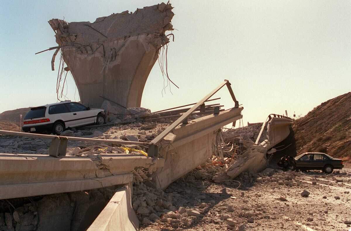 Cars lie crushed beneath the collapsed Interstate 5 connector after the Northridge earthquake in Sylmar in January 1994. Scientists say new research reinforces that stress continues to build along the southern San Andreas and San Jacinto fault systems, although they cannot predict when a magnitude 7 or larger earthquake might occur.