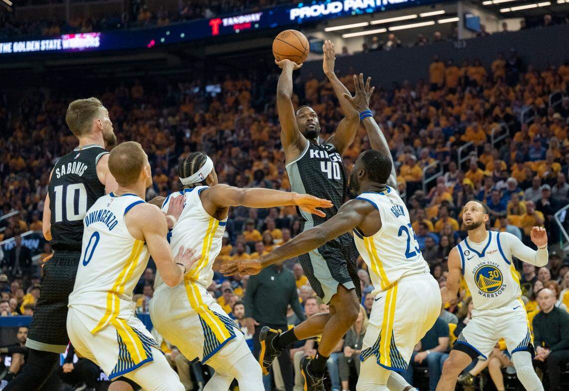 Sacramento Kings forward Harrison Barnes (40) shoots over Golden State Warriors forward Draymond Green (23) during Game 4 of the first-round NBA playoff series at Chase Center in San Francisco on Sunday.