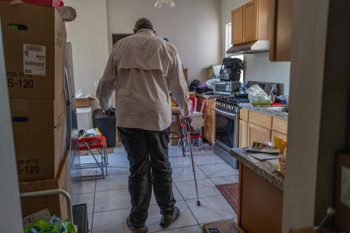 Leonard Powell walks with his cane through the new kitchen of his Berkeley home in July. He doesn’t understand why the Bay Area Receivership Group needed to do such extensive renovations. “I’m not denying that the house needed work but I’m denying that it needed Italian tile, it needed all this cabinetry, that it needed new appliances,” he said.