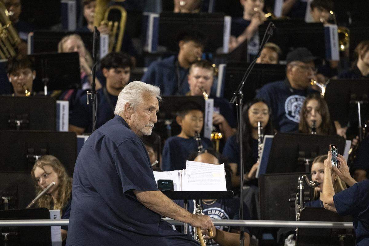 Destiny Christian Academy band director Jim Reber leads the band during a game between Destiny Christian Academy and Inderkum at Destiny Christian Academy in Rosemont on Friday.