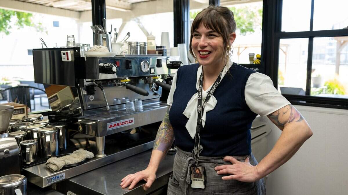 Jamie Mason, who teaches inmates how to be baristas at the Rio Cosumnes Correctional Center near Elk Grove, stands with a La Marzocco espresso machine at Redemption Coffee, the jail’s internal cafe and training center, on Wednesday.