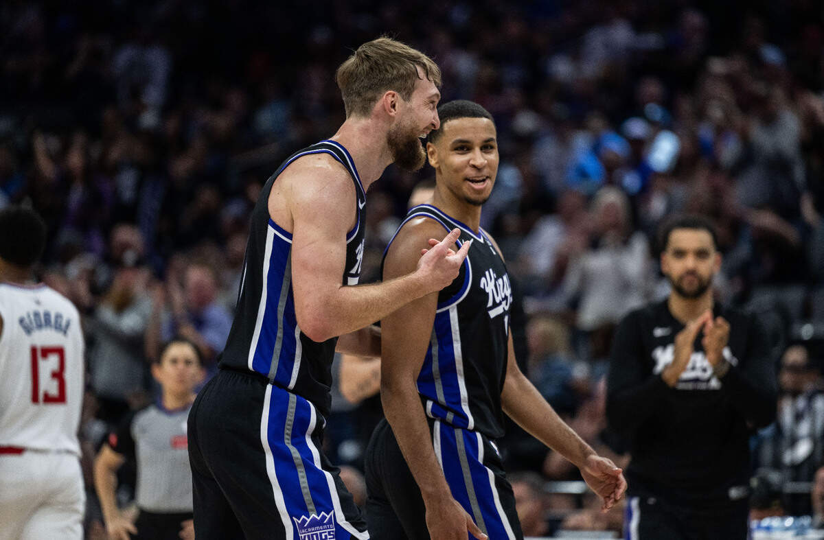 Sacramento Kings forward Domantas Sabonis (10) points to teammate forward Keegan Murray (13) after he got an assist during an NBA game the Los Angeles Clippers on Tuesday, April 2, 2024 at Golden 1 Center.