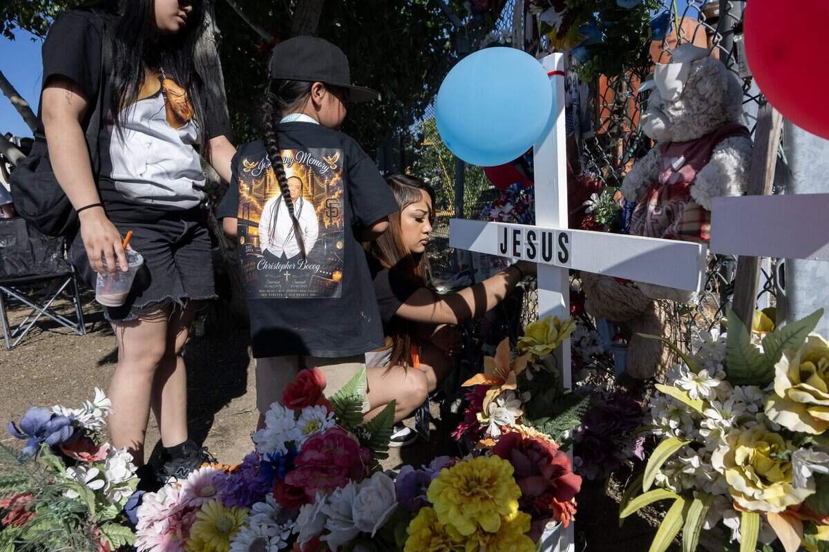 Leilani Semana, Quincey Boca and Melanie Semana leave remembrances Wednesday at a memorial for their father and six others who died in the Esparto fireworks explosion on the first anniversary of the event.