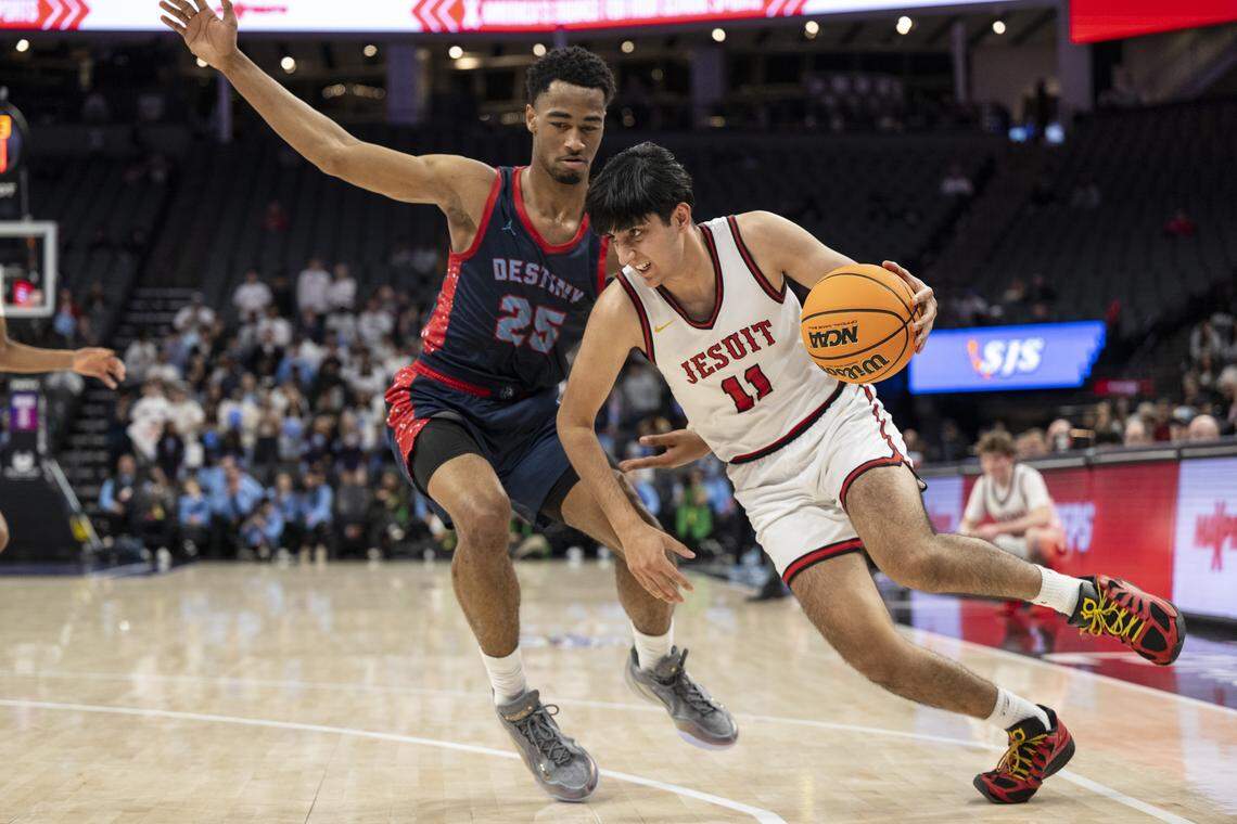 Jesuit’s Sahib Randhawa dribbles past Destiny Christian Academy’s Myles Wiggins during the CIF Sac-Joaquin Section Division II boys basketball championship at Golden 1 Center on Friday. Both teams will start on the road in the NorCal Division I bracket. 