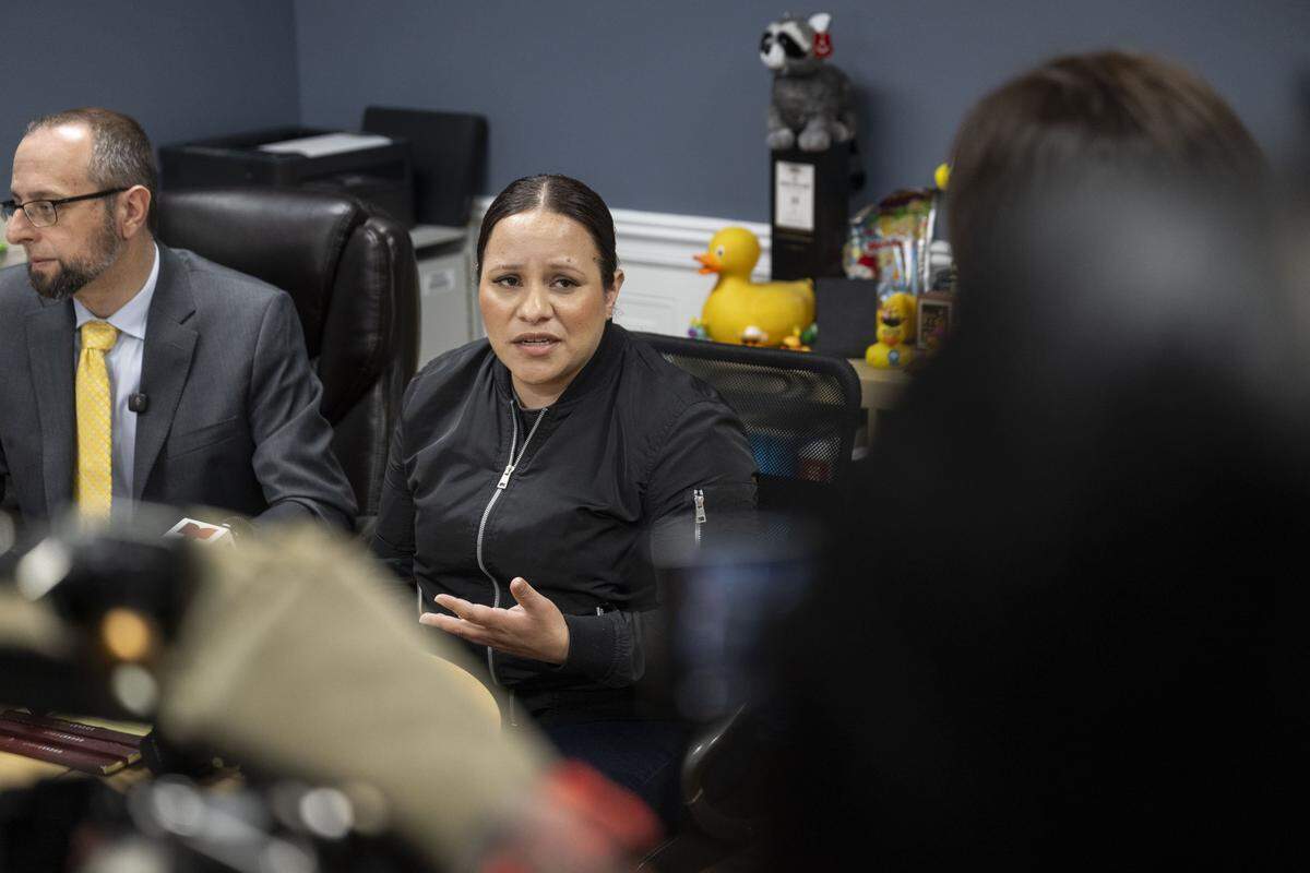 Cindy, the fiancee of Carlos Ivan Mendoza Hernandez — who was shot by ICE officers during a traffic stop in Patterson, makes a statement at the office of their attorney in Modesto on Wednesday, April 8, 2026. Attorney Patrick Kolasinski distributed documents that proved his client was acquitted of crimes ICE accused him of in El Salvador.