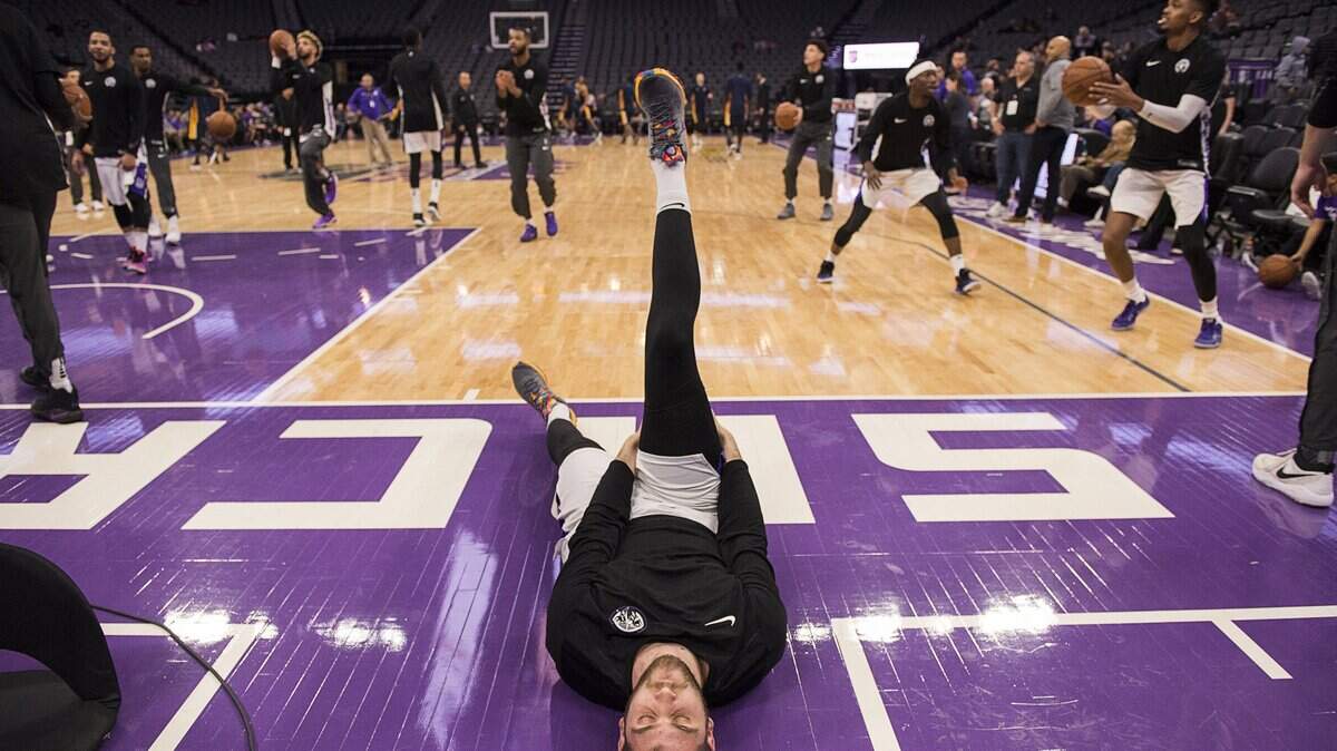 Reno Bighorns Georgios Papagiannis stretches before game at Golden 1 Center in Sacramento, Calif. on Sunday January 7, 2018. 
