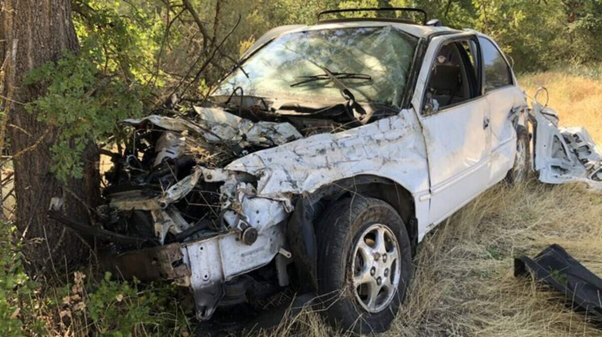 At least one person died after a vehicle traveled off of Highway 65 and crashed Friday morning.