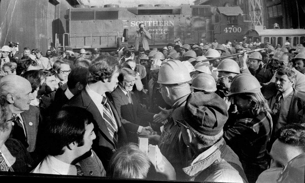 A smiling Jimmy Carter was awash in a sea of hardhats during a visit with Southern Pacific workers in the downtown Sacramento railyard on Nov. 1, 1976.