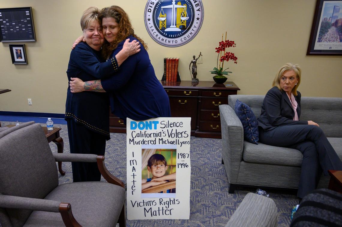 Two mothers whose sons were murdered embrace after meeting with Sacramento District Attorney Anne Marie Schubert. Phyllis Loya, left, and Sandra Friend, right, met with Schubert, far right, in response to California Gov. Gavin Newsom’s moratorium on the death penalty on Wednesday, March 13, 2019 in Sacramento. Loya is the mother of slain Pittsburg police officer Larry Lasater Jr. and Friend is the mother of 8-year-old Michael Lyons, who was abducted in Yuba City, then tortured, raped and murdered.