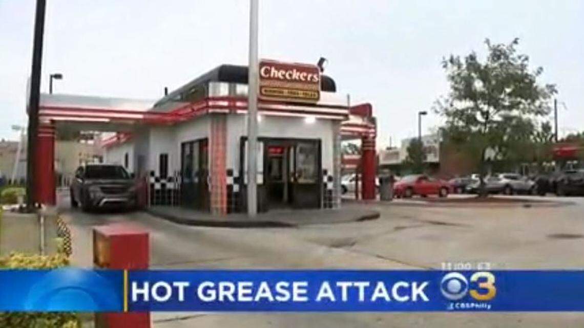 A fast food worker hurled hot grease through a Checkers drive-through window early Saturday at three women who complained about a wrong order, Philadelphia police say. The driver had first-degree burns.