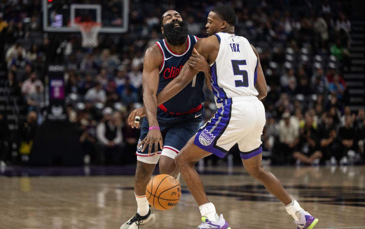 Los Angeles Clippers guard James Harden (1) is fouled by Sacramento Kings guard De’Aaron Fox (5) during an NBA game on Friday, Nov. 8, 2024 at Golden 1 Center.